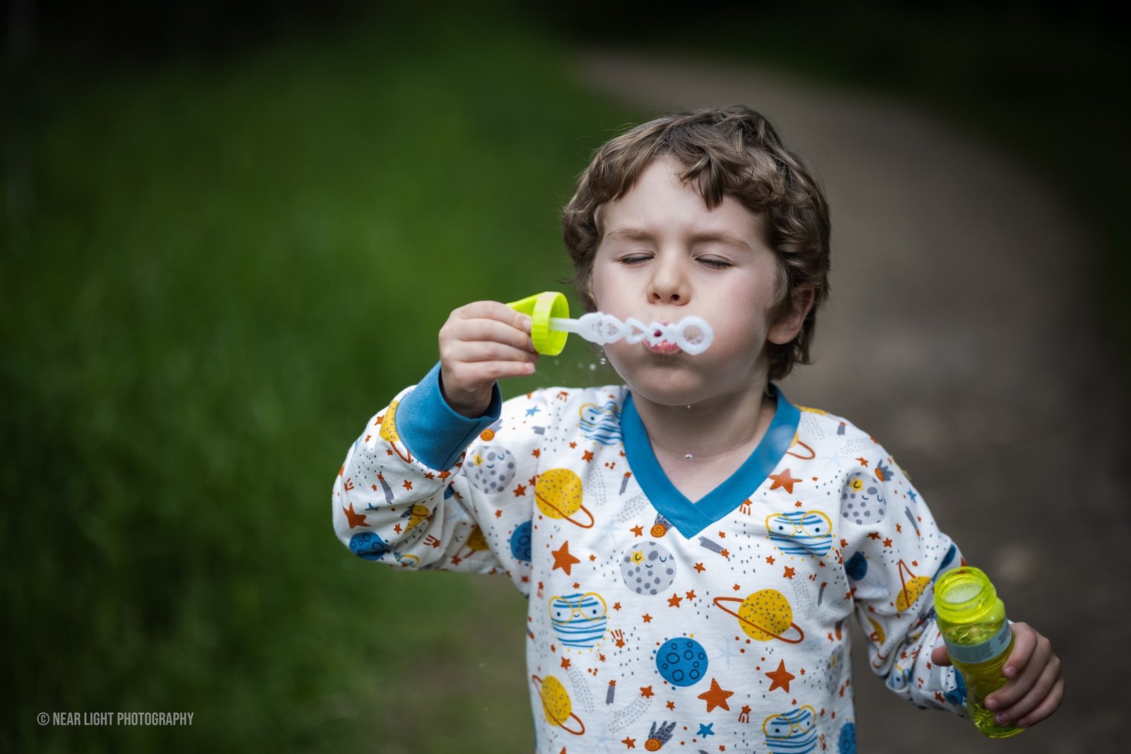 Child and bubbles in outdoor light
